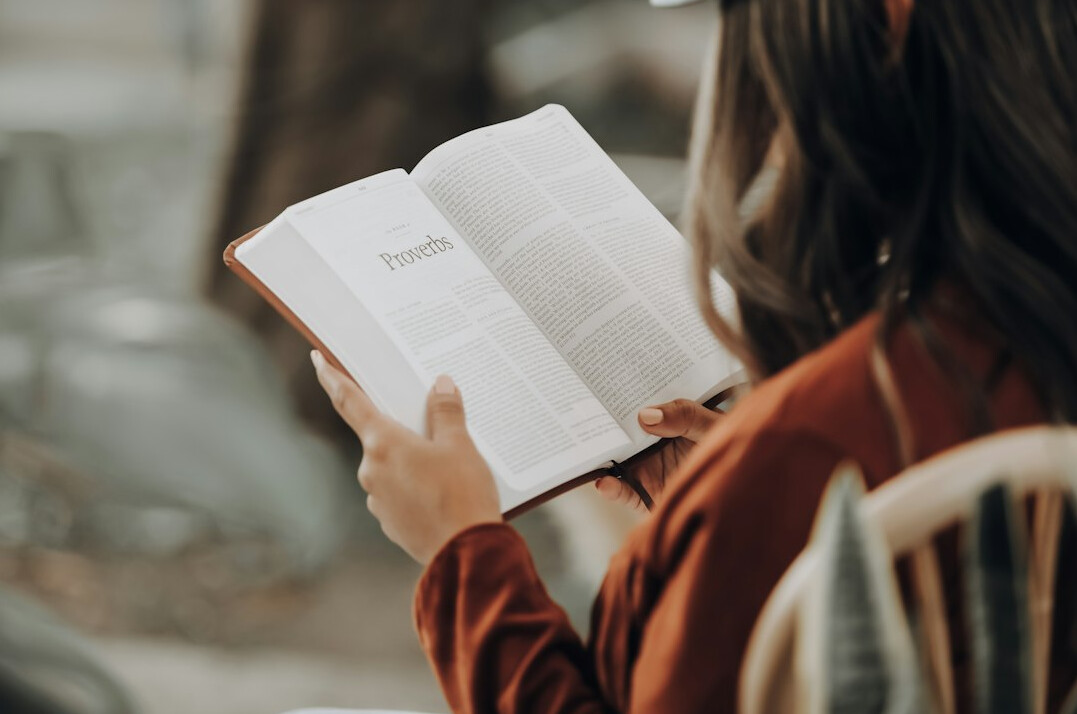 woman reading self help book