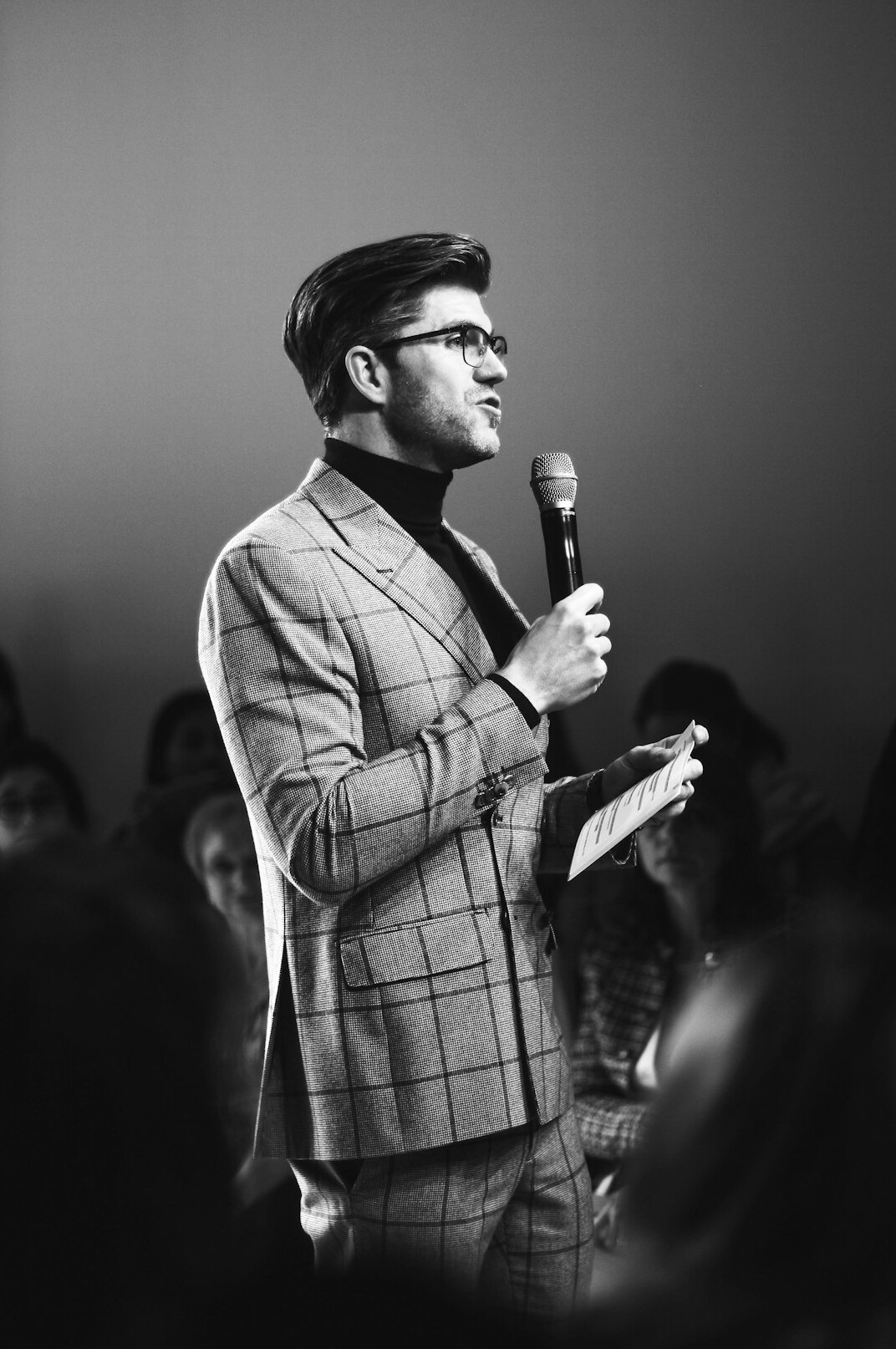 confident person speaking on stage