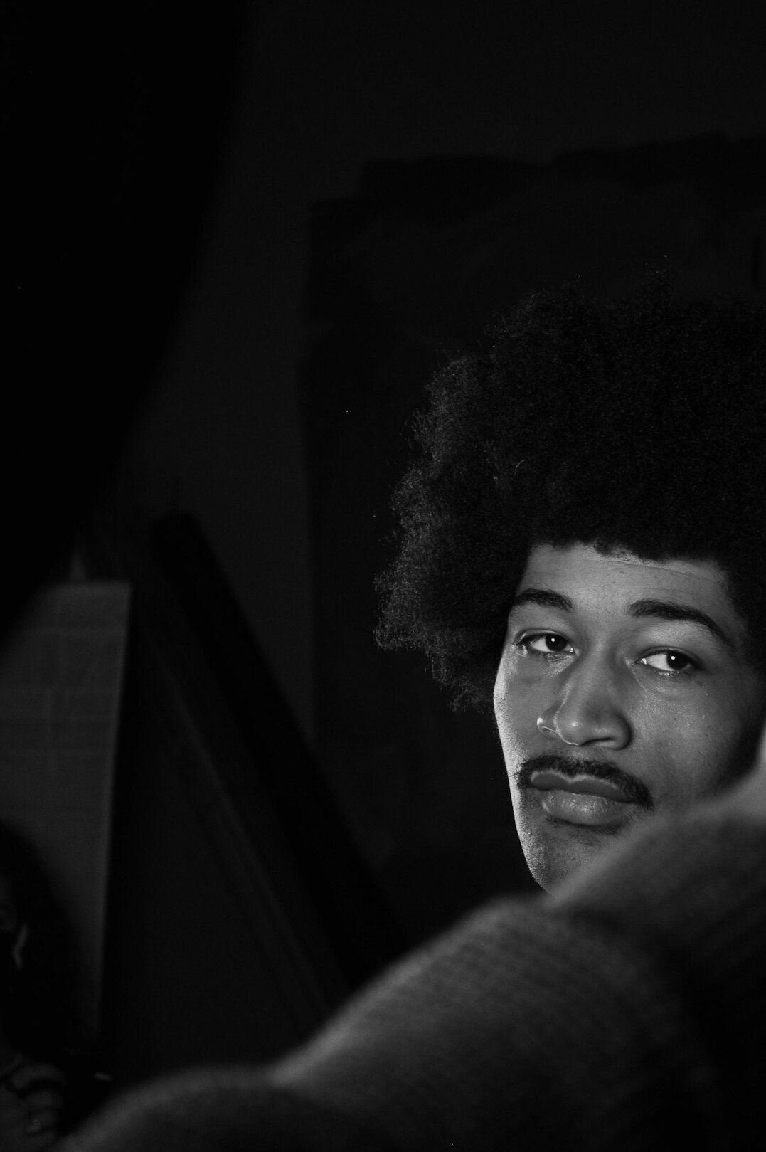 Studio portrait of an Afro-Brazilian man smiling
