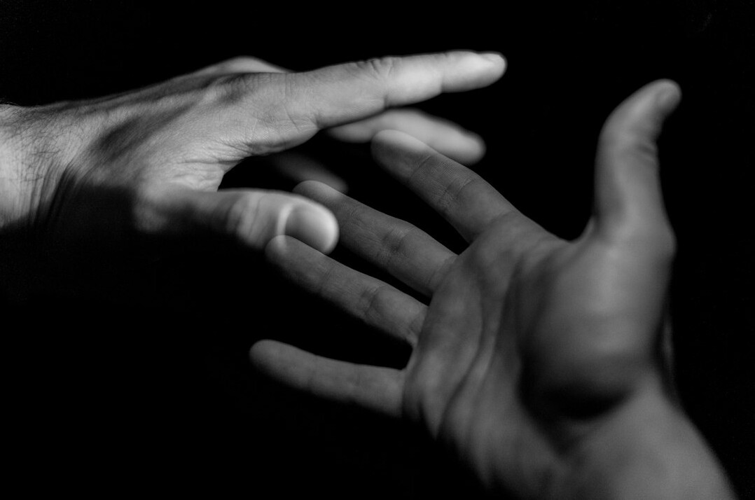 Close-up of hands exchanging a warm handshake