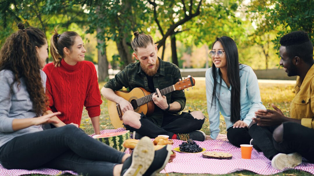 Group of friends laughing together outdoors